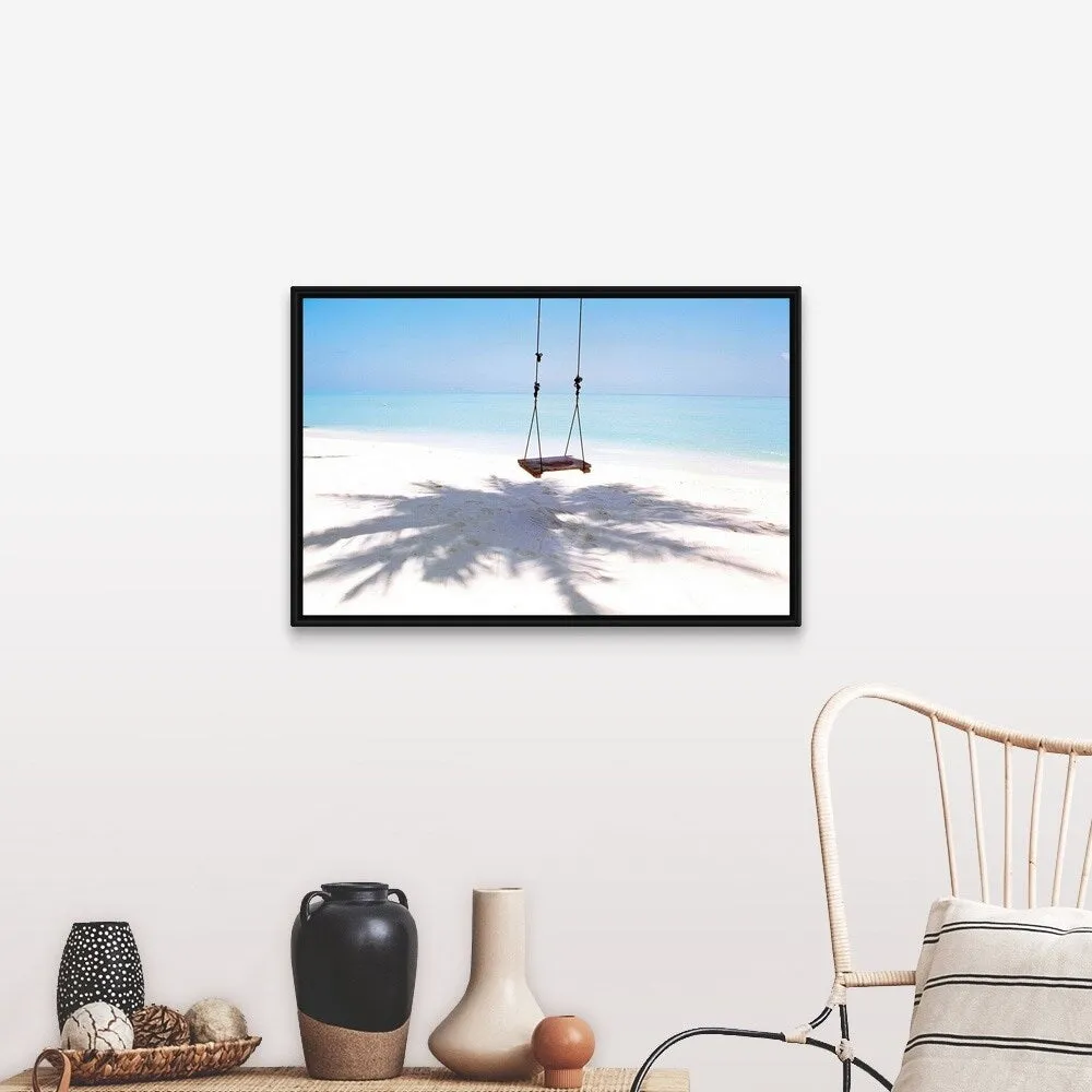 "Beach swing and shadow of palm tree on sand" Black Float Frame Canvas Art